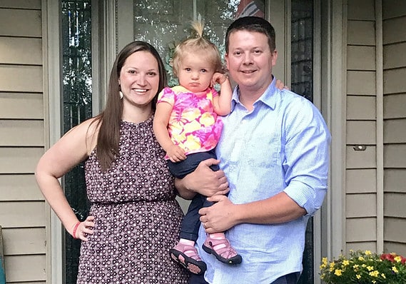 family smiling at camera